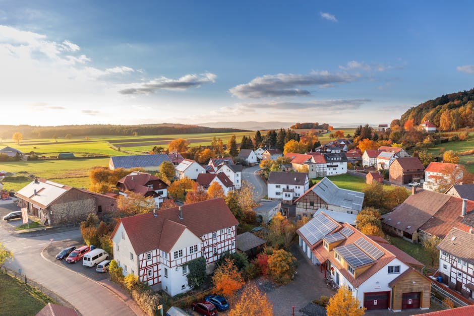 Charming aerial view of a rural village in autumn with vivid colors and clear skies